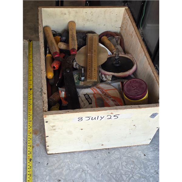 Wooden box full of tools and parts