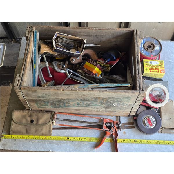 Wood crate with various tools and hardware