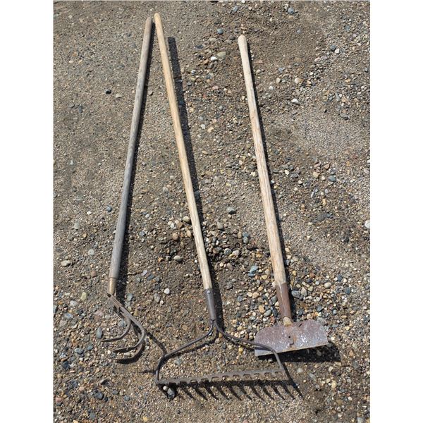 Assorted hand tools- rakes, scraper