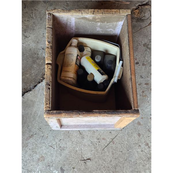 Crate of oil containers- most are half full