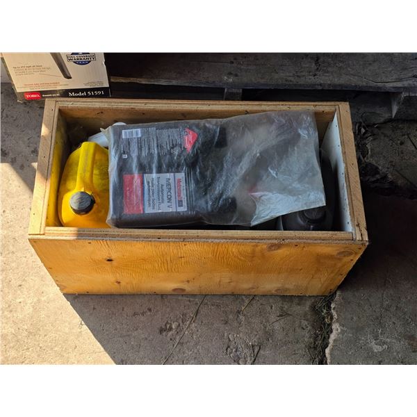 Crate of oil containers- most are half full