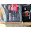 Image 3 : Crate of oil containers- most are half full