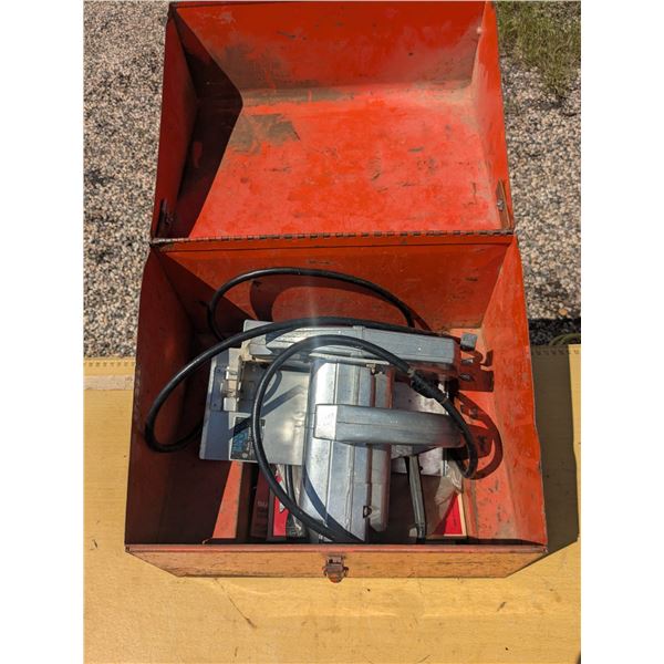 vintage circular saw, in case with extra blades