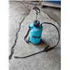 Image 1 : Sprayer with some liquid in it