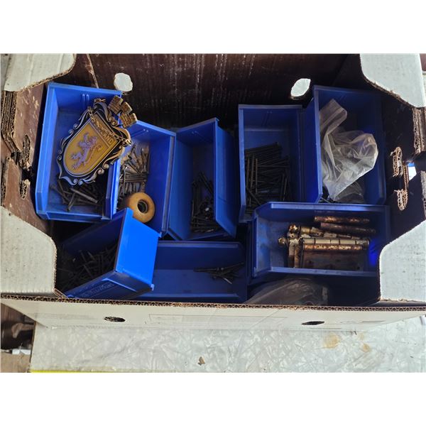 Box full of hardware and blue organizer bins