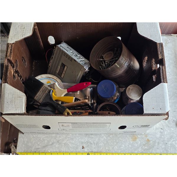 Box of hardware and paint brushes