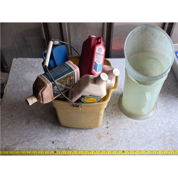 Plastic bin with oil and funnels