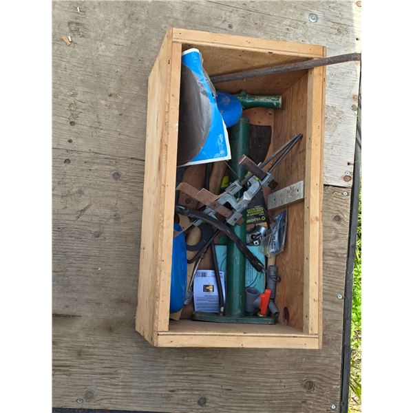 Crate full of tools and hardware, air pump, axe
