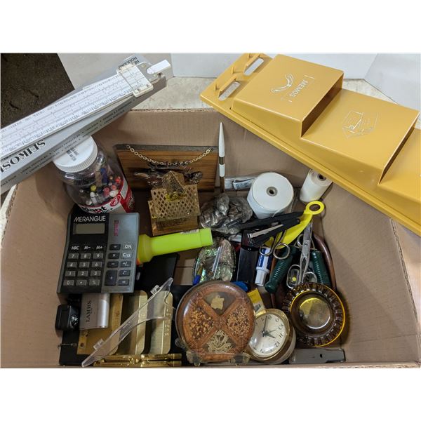 box of home office supplies and décor