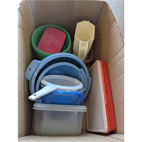 box of plastic kitchen dishes
