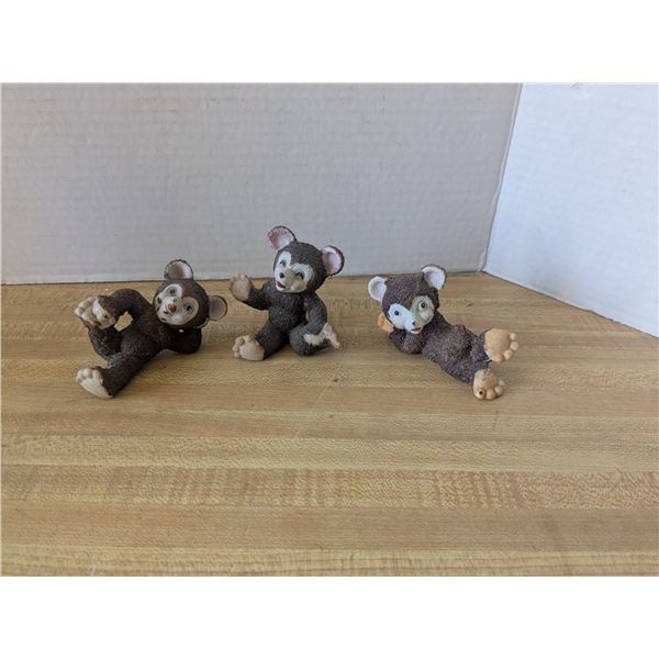 3 monkey figurines
