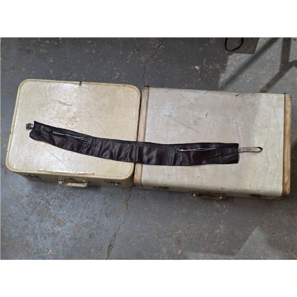 2 suit cases and leather belt
