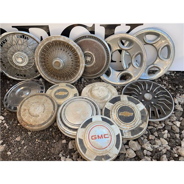 Hubcaps Lot Including GMC, Chevrolet, And Ford