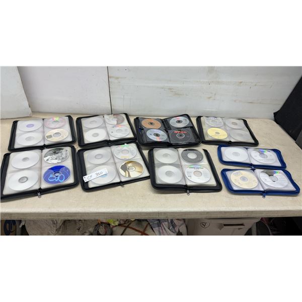 Assorted CD Storage Cases with Country and Classic Hits CDs Including Tracy Lawrence and More