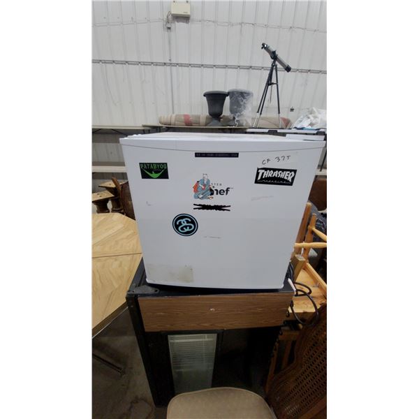 Compact Single-Door Mini Refrigerator with Freezer Compartment and Aftermarket Stickers