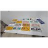 Image 1 : Collection of 17 Vintage and Modern License Plates: Manitoba, Alberta, and Puerto Rico