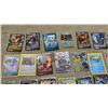 Image 2 : 100 (+/-) Pokémon Trading Card Game Lot: V, VMAX, EX, & Trainer Cards, Energy Cards, & More