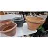 Image 2 : Assorted Plant Pots Including Terracotta, Green, and Gray Plastic and Clay Planters