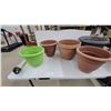 Image 3 : Assorted Plant Pots Including Terracotta, Green, and Gray Plastic and Clay Planters