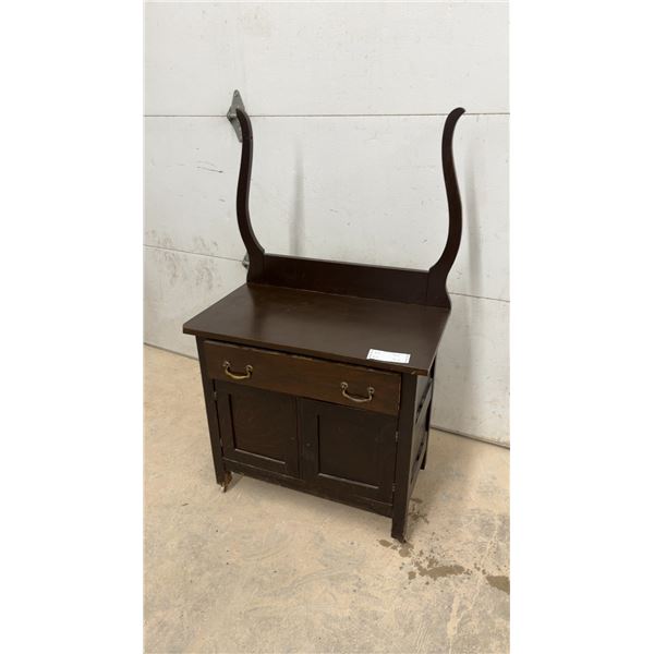 Dark Wood Dresser with Curved Backsplash and Brass Pulls