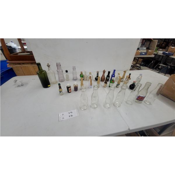 Vintage Glass Bottle Collection: Embossed Milk Bottles, Tanqueray, and 7Up