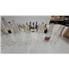 Image 2 : Vintage Glass Bottle Collection: Embossed Milk Bottles, Tanqueray, and 7Up