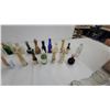 Image 4 : Vintage Glass Bottle Collection: Embossed Milk Bottles, Tanqueray, and 7Up