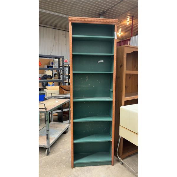 Tall Narrow Wooden Bookshelf with Carved Trim, Reddish-Brown Finish and Green Interior, with