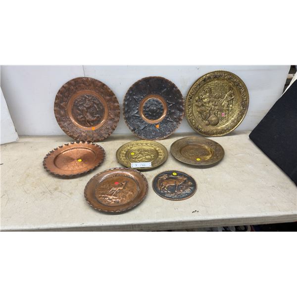 Collection of 8 Embossed Metal Decorative Plates: 5 Copper and 3 Brass, including Aztec Calendar