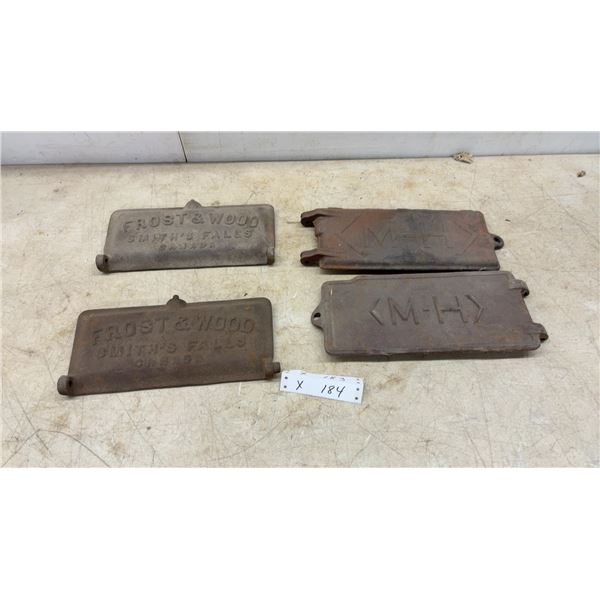 Four Cast Iron Tractor Tool Box Covers: Two Frost and Wood, Smith's Falls, Canada; Two (M-H)