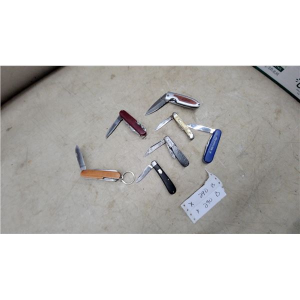 Collection of Folding Pocket Knives Including Victorinox, Barlow, and Alfa Laval Agri