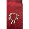 Image 12 : Avon Jewelry Lot: 2 Rings, 1 Charm Bracelet, and Tree Ornament