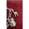 Image 13 : Avon Jewelry Lot: 2 Rings, 1 Charm Bracelet, and Tree Ornament