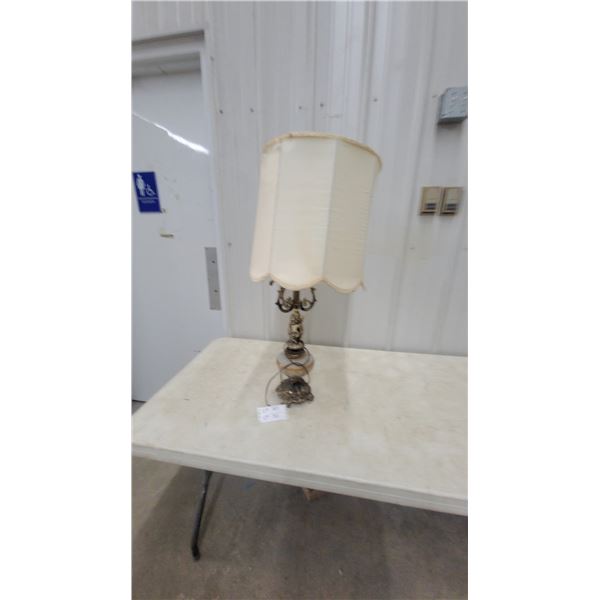 Ornate Vintage Table Lamp with Cherub Figures, Brass Scrollwork, and Scalloped Fabric Shade