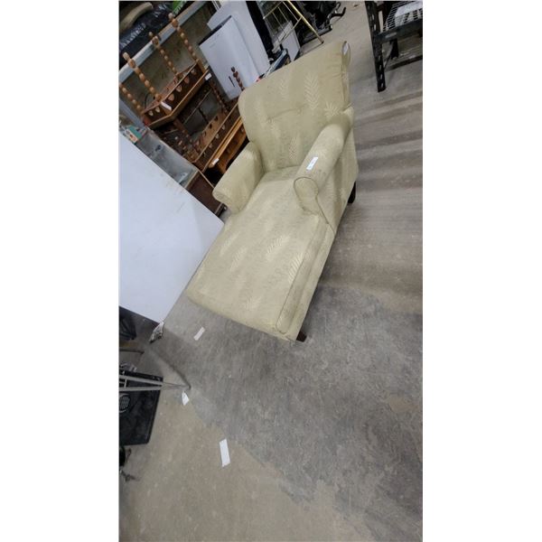 Light Green Upholstered Chaise Lounge with Leaf Pattern and Dark Wood Legs
