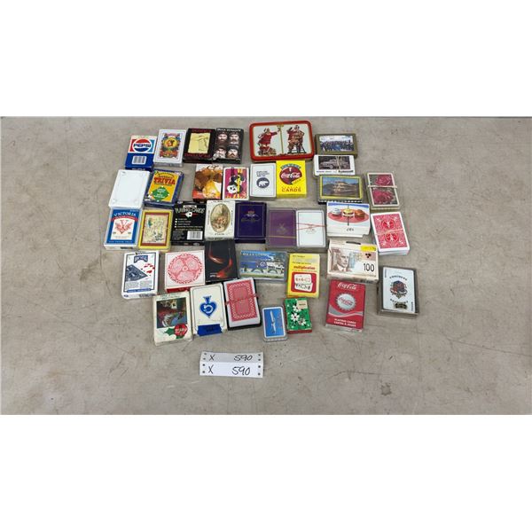 Assorted Playing Cards Including Coca-Cola, Pepsi, Bicycle, Crown Royal, Duck Dynasty