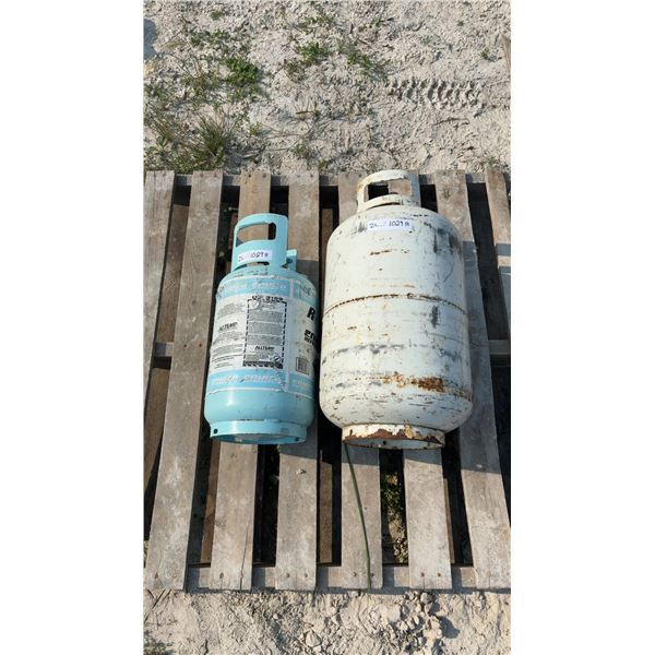 Two Empty Tanks: One 30 lb. Refrigerant Gas and One Possibly Propane