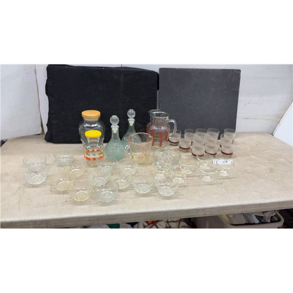 Assorted Glassware: Decanters, Pitcher, Juice Reamer, Measuring Cup, and Drinking Glasses