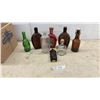 Image 1 : Assorted Bottles: 2 Brown Embossed Flasks, Red Tequila and Green Soda Bottles
