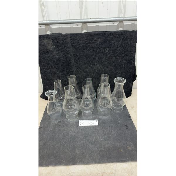 Collection of Nine Clear Glass Oil Lamp Chimneys with Various Heights and Profiles