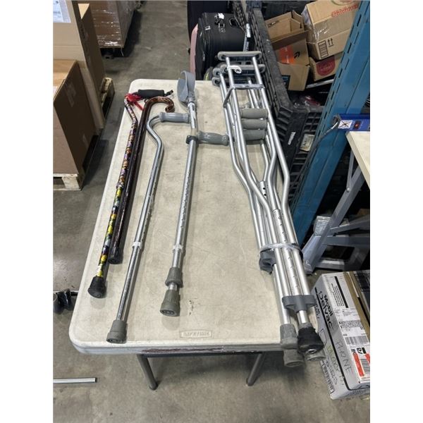 3 WALKING CANES, 2 PAIRS OF CRUTCHES, AND A SINGLE CRUTCH