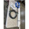 Image 1 : HOSE W/ METER, ATTATCHMENTS, AND PVD PIPING W/ CONNECTIONS