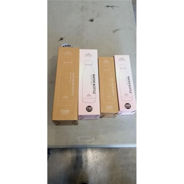 4 NEW MONT-CLAIR STAINLESS STEEL WATER BOTTLES. 1 WHITE, 1 RED, 1 PINK, 1 DARK BLUE