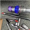 Image 2 : DYSON V15 TOTAL CLEAN CORDLESS STICK VACUUM WITH CHARGER AND ACCESSORIES WORKING