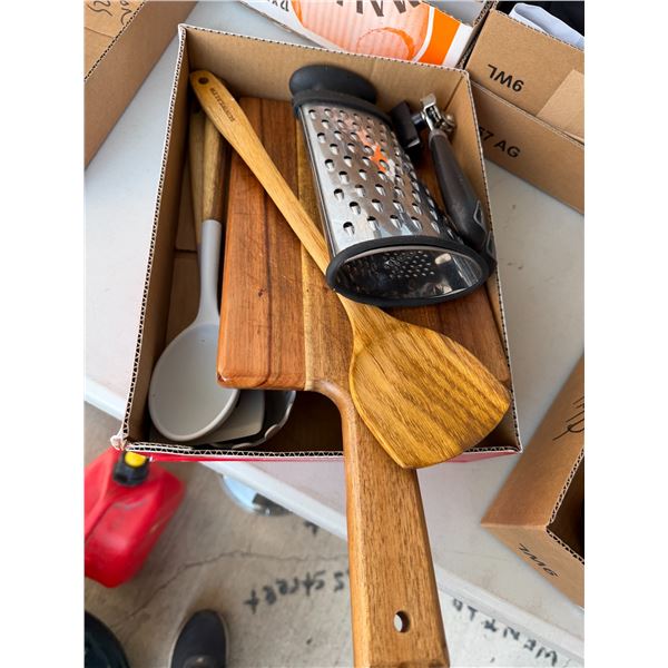 Kitchen, utensils, and wood charcuterie board