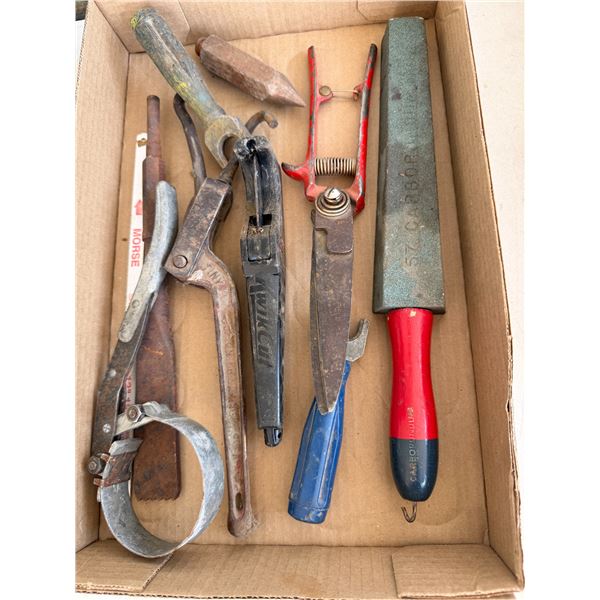 Assorted tools and sharpening stone