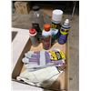 Image 1 : Garage related fluid and gloves.