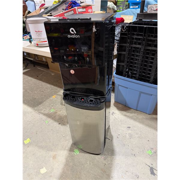 Water machine bottle goes in the bottom
