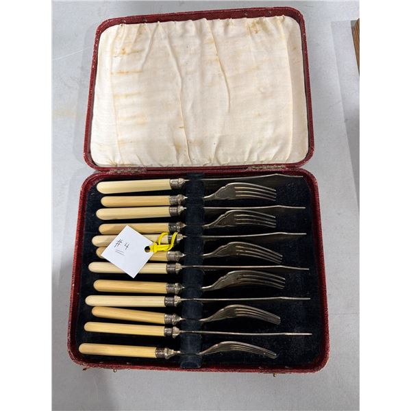 Antique fish knife set with sterling bolsters