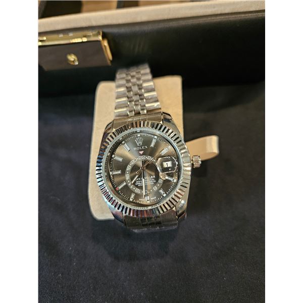 Rolex branded watch with metal band